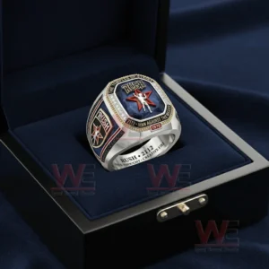 Rush themed silver championship ring with a deep blue gemstone face shown inside an open luxury ring box with a deep blue interior.