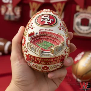 Hand holding a San Francisco 49ers anniversary decorative egg with Levis Stadium artwork and red gold detailing!