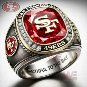 Black and gold San Francisco 49ers ring with a large red gemstone top SF logo clear stone border San Francisco 49ers text on the rim side emblem detail and Faithful To The Bay engraving inside!