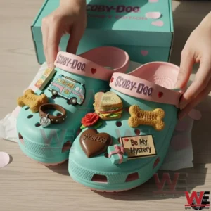 Scooby Doo Be My Mystery Clogs Crocs with Charms 4 Hands presenting teal Scooby Doo clogs with pink straps and multiple themed charms in front of a Scooby Doo Valentines Edition box!