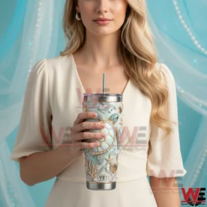Woman holding sea turtle themed Yeti tumbler in a stylish setting!