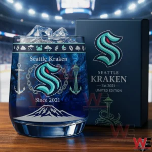 A Seattle Kraken whiskey glass with ice and since two thousand twenty one text next to a limited edition gift box!