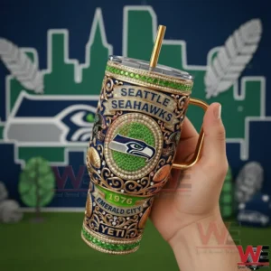 Handheld view of a green and gold insulated tumbler with detailed Seattle Seahawks Emerald City artwork and a stadium inspired background!