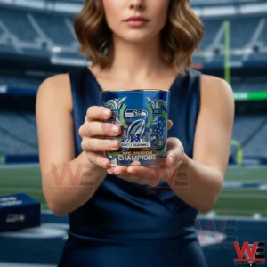 Person holding Seattle Seahawks division champions glass in a stadium!