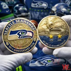 Two sided Seattle Seahawks anniversary coin held in white gloves showing the team logo on one side and an eagle over a stadium with years 1976 and 2026 on the other.