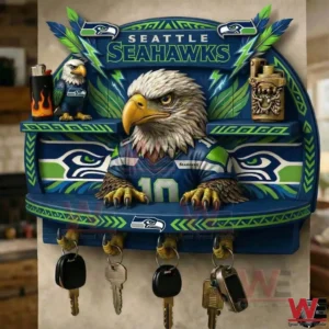 A wall mounted Seattle Seahawks key holder with an eagle mascot design colorful patterns and multiple keys hanging neatly below!
