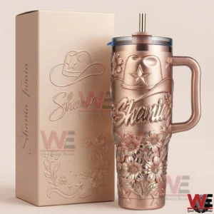 Shania Twain themed tumbler with handle and straw featuring raised flowers and star details displayed next to a matching box!