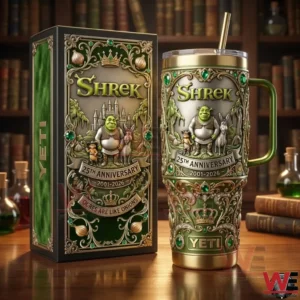 A Shrek themed anniversary tumbler and collector box featuring intricate fantasy designs green colors gold trim and character illustrations on a wooden table background!