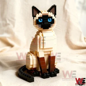 Brick built Siamese cat figure with cream body dark face blue eyes and sitting posture displayed on a neutral fabric surface!