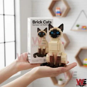 Brick built Siamese cat model held in hands with product box and home interior background visible!