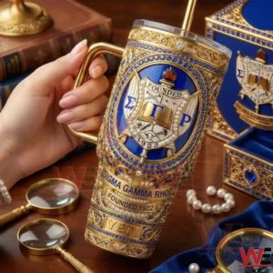 A close view of a hand holding a Sigma Gamma Rho themed YETI tumbler with refined jewelry inspired details and a classic study background!
