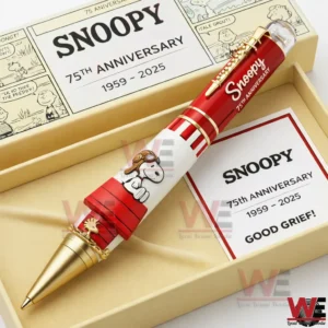 Snoopy anniversary pen in a cream presentation box with red white design gold accents and a matching card showing 75th anniversary 1959 2025.