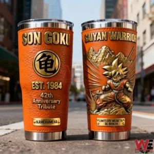 Two orange Son Goku insulated tumblers with Saiyan warrior design and anniversary tribute standing on a street setting!