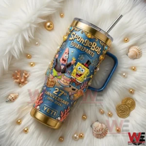 A SpongeBob SquarePants themed insulated tumbler featuring anniversary artwork is placed on a fluffy white surface with shells pearls and marine elements!