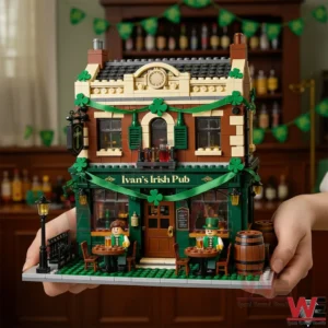 Hands holding an Ivans Irish Pub building block model with green shamrock garlands outdoor tables mini figures and barrels in a festive bar setting.