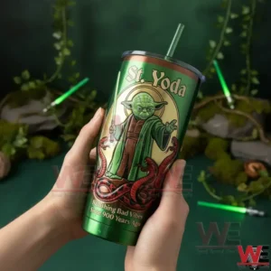 Hands holding a green Saint Yoda themed insulated tumbler with fantasy artwork and mystical green background!