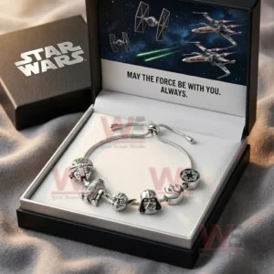 Gift boxed adjustable silver tone charm bracelet with Star Wars inspired charms inside a black box with space artwork and May The Force Be With You Always text.