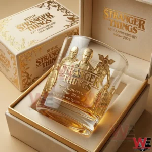 A Stranger Things 10th anniversary whiskey glass in a premium gift box with gold character artwork and 2016 2026 commemorative details on elegant collector packaging