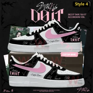 Black and white high top Air Jordan one sneaker with pink swoosh pink patterned panels do it themed accents signature style markings and custom name displayed on a shoebox with album themed background