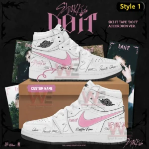 White high top Air Jordan one sneaker with pink swoosh Stray Kids do it text signature style markings and custom name shown on a shoebox with album themed background