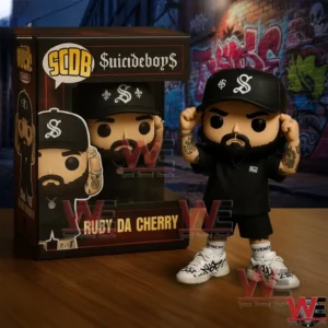 Rapper vinyl figure in black outfit standing next to a themed display box on a wooden surface!
