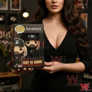 Suicideboys Ruby Da Cherry Pop Figure 4 Woman holding a boxed rapper vinyl figure in a modern studio environment!