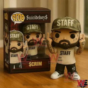 A boxed and unboxed music collectible figure with staff branding beard tattoos and urban style details displayed on a wooden surface!
