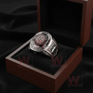 Ring placed in an open wooden presentation box with black velvet lining and a black gemstone centerpiece featuring the Supernatural symbol!