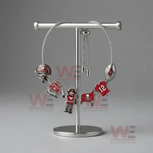 Adjustable Tampa Bay Buccaneers themed charm bracelet on a T bar stand with helmet pirate ship pirate figure flag and number twelve jersey charms.