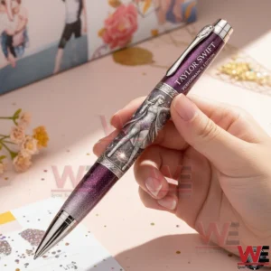 Taylor Swift Performance Edition Pen 3 Hand holding a Taylor Swift performance edition metal pen in a bright creative setting!