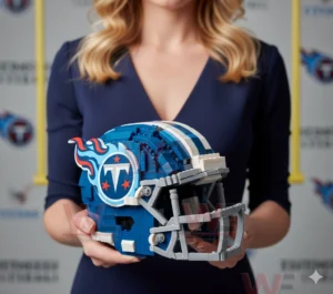 Hands holding a blue Tennessee Titans football helmet model made from building blocks with a Titans logo on the side!