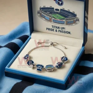 Silver adjustable charm bracelet in a light blue gift box with Titan Up Pride and Passion message featuring Tennessee Titans logo helmet number twenty two stadium football and Titan Up charms.