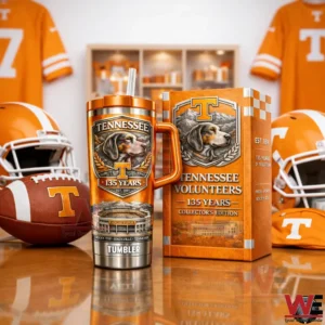 Tennessee Volunteers 135 years tumbler with handle and straw next to a matching orange collector edition box with football helmets jerseys and a Tennessee football in the background!