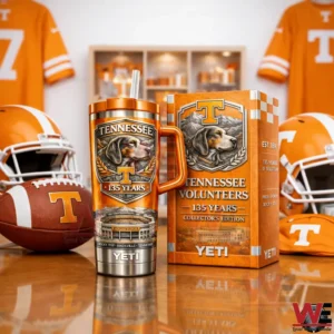 Tennessee Volunteers 135 Years Collector’s Edition YETI Tumbler 4 Tennessee Volunteers 135 years insulated tumbler with orange handle and straw displayed next to a matching collectors edition gift box with team helmets in the background.