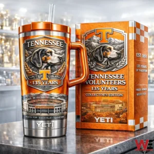 Tennessee Volunteers 135 Years Collector’s Edition YETI Tumbler 5 Orange Tennessee Volunteers 135 years insulated tumbler with handle and straw displayed next to a matching collectors edition gift box on a reflective surface.