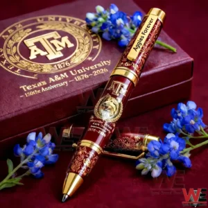 Texas AM 150th anniversary maroon and gold pen with Aggies Forever clip placed near a matching university gift box and blue flowers!