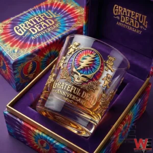 Grateful Dead anniversary whiskey glass with skull and dancing bear design resting in a decorative gift box with tie dye pattern background!