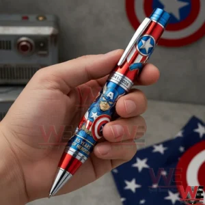 A close view of a hand holding a Captain America anniversary pen with iconic shield details and an eighty five year tribute to heroism!