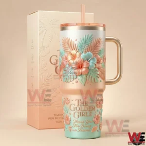 The Golden Girls themed tumbler with handle and straw featuring raised floral tropical details displayed next to a matching pastel box!