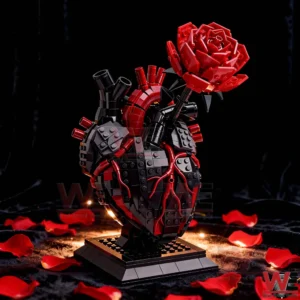 An anatomical heart brick sculpture with a red rose centerpiece displayed on a black background with rose petals!