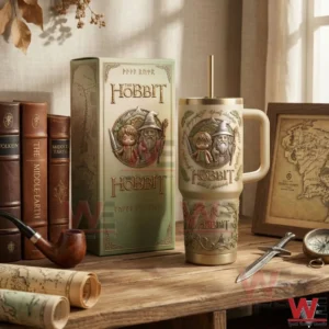 The Hobbit themed tumbler with Bilbo and Gandalf artwork handle metal lid and straw displayed next to a matching collector box on a wooden table!