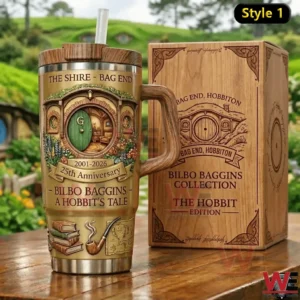 Insulated tumbler with a Bag End Shire illustration and twenty fifth anniversary text shown beside a wooden style gift box for The Hobbit edition.