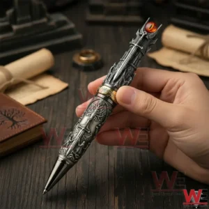 Hand holding a Lord of the Rings inspired collector pen with intricate engravings and a fiery eye detail on the top!