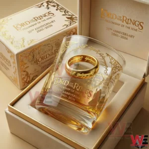 A The Lord Of The Rings 25th anniversary whiskey glass in a premium gift box featuring gold elvish artwork a ring design and 2001 2026 commemorative text on a luxury presentation display