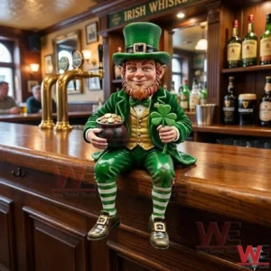 Green leprechaun figurine sitting on a wooden bar counter holding a pot of gold and a shamrock in an Irish pub setting.