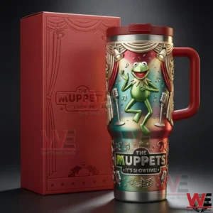 Close view of a stage themed handled tumbler with a green frog performer next to a red presentation box!