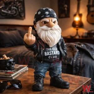 Biker gnome figurine with white beard skull bandana leather jacket jeans and boots standing on a table in a bedroom setting.