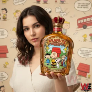 Close view of a woman holding a Peanuts anniversary whiskey bottle with classic character artwork and a crown stopper in front of a comic style backdrop!