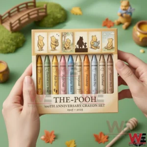 The Pooh 100th Anniversary 1925-2025 Crayon Set 3 Hands holding The Pooh one hundred year anniversary crayon set with themed illustrations and soft colored crayons!