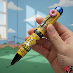 Hand holding a The Simpsons character pen with donut detail bright yellow design and playful cartoon scene behind it.